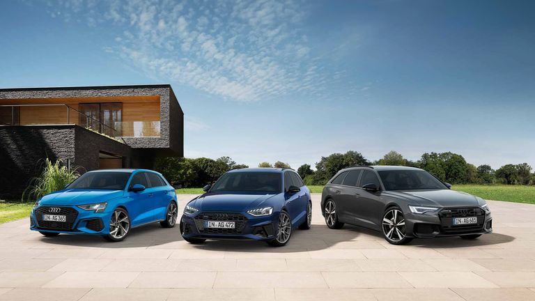 Audi A3, A4 und A6 Avant vor moderner Architektur.